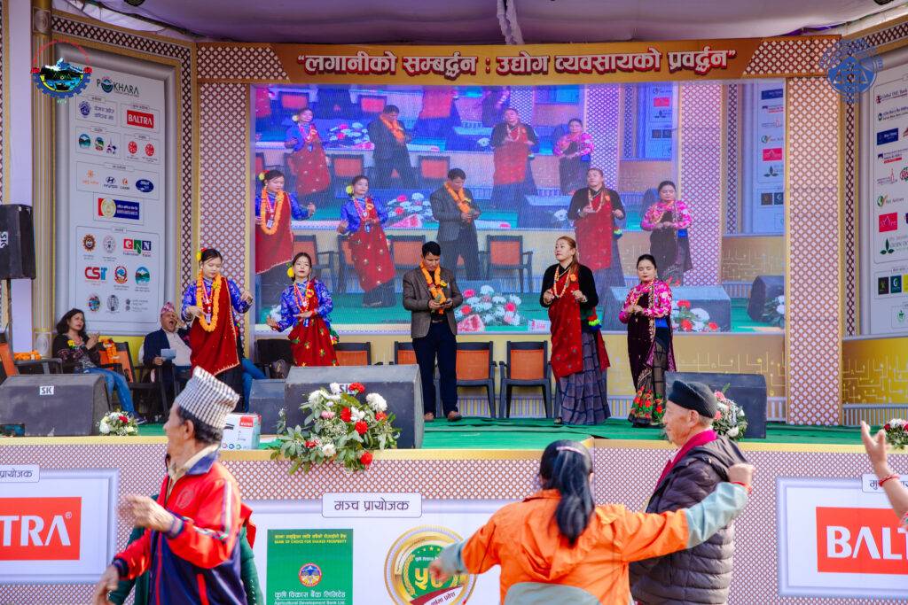 A group of people singing and dancing
