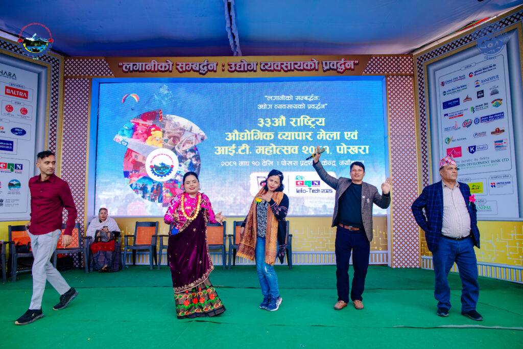 A group of people singing and dancing in the stage